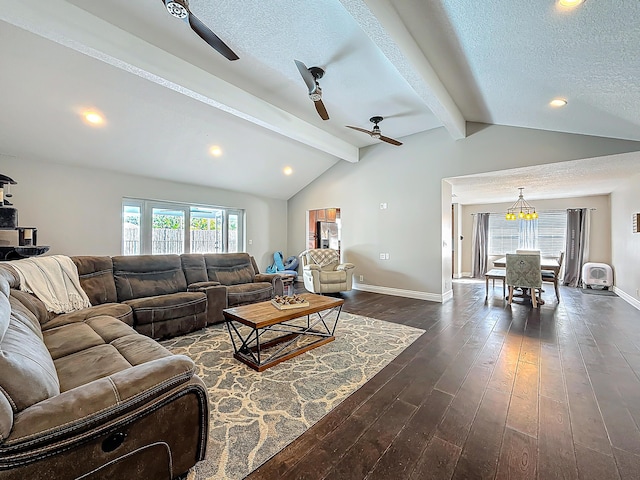 living room with vaulted ceiling with beams, a healthy amount of sunlight, a textured ceiling, and dark wood-style flooring