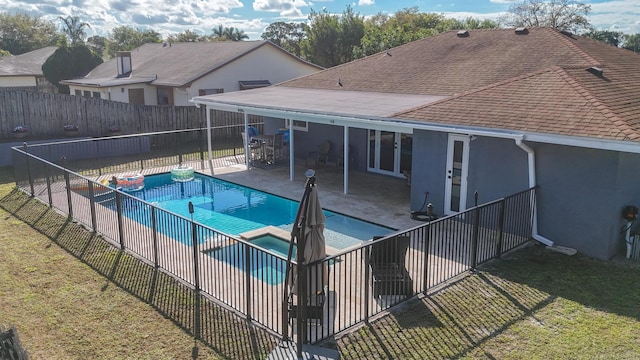 view of pool with a fenced in pool, a patio area, a fenced backyard, and a yard