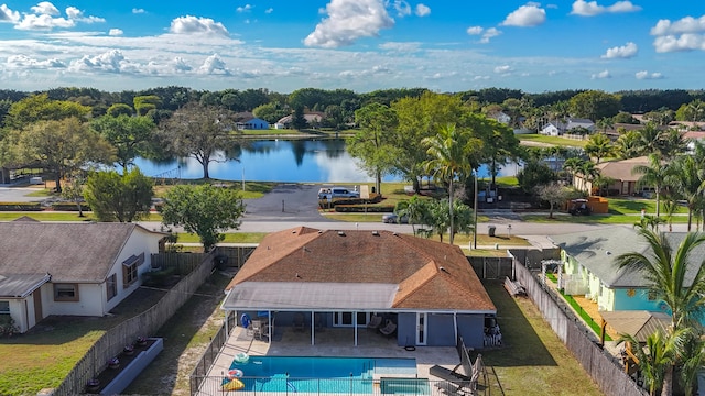 drone / aerial view featuring a water view and a residential view