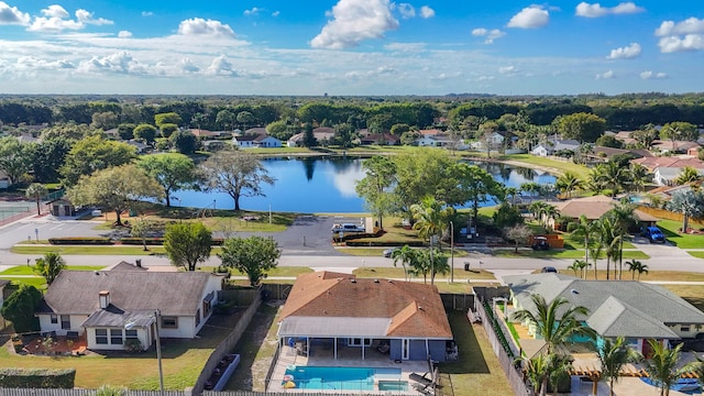 birds eye view of property with a water view and a residential view