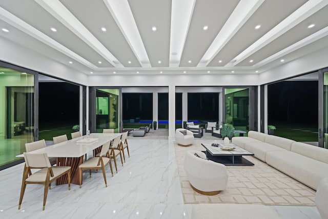 living area featuring recessed lighting, marble finish floor, and beam ceiling