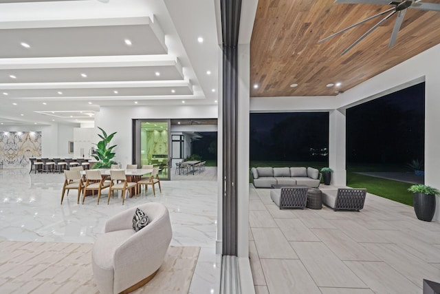 view of patio / terrace with an outdoor hangout area, outdoor dining space, and a ceiling fan