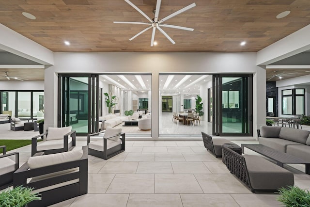 interior space with outdoor dining area, ceiling fan, and outdoor lounge area