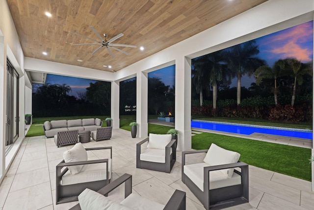 view of patio / terrace with an outdoor pool, an outdoor living space, and a ceiling fan