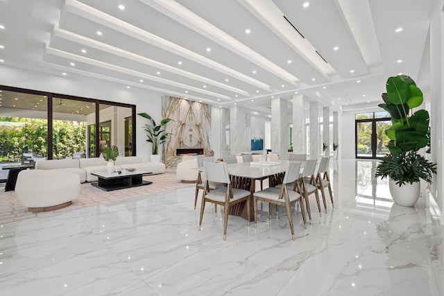 dining space featuring marble finish floor, a fireplace, and recessed lighting