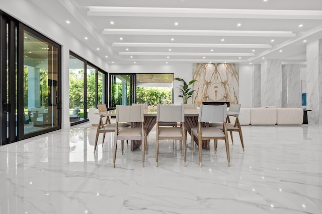 dining space featuring recessed lighting, beam ceiling, marble finish floor, and stone wall