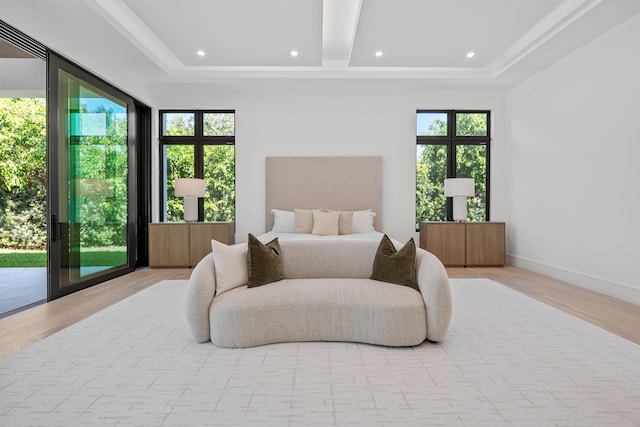 bedroom with recessed lighting, a raised ceiling, wood finished floors, access to outside, and baseboards