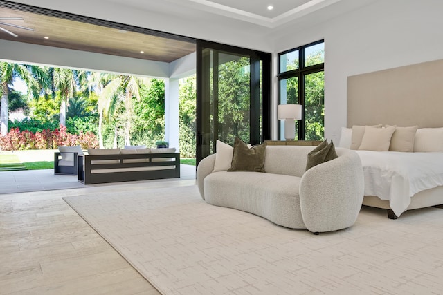 bedroom featuring access to exterior, recessed lighting, and wood finished floors