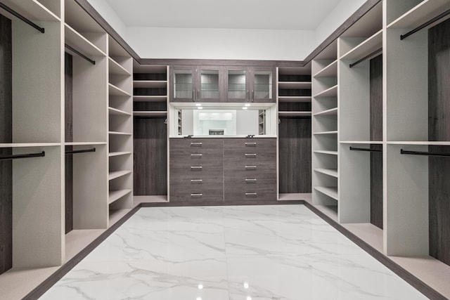 spacious closet with marble finish floor