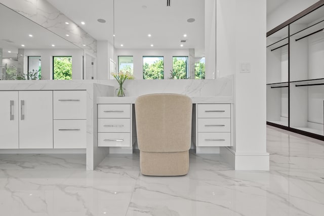 office area with marble finish floor and recessed lighting