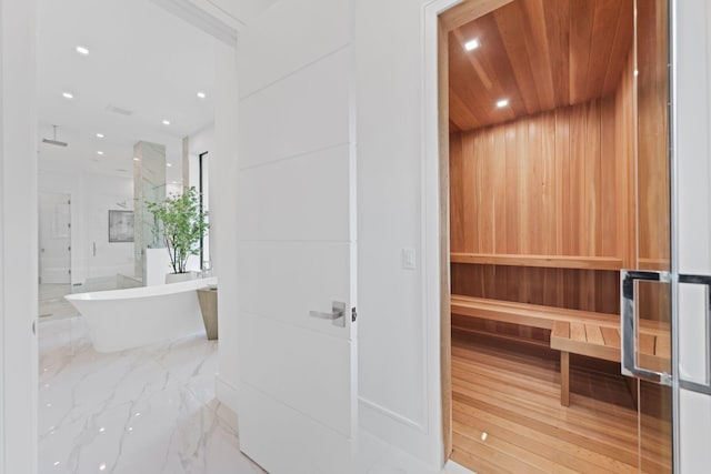 view of sauna with marble finish floor and recessed lighting