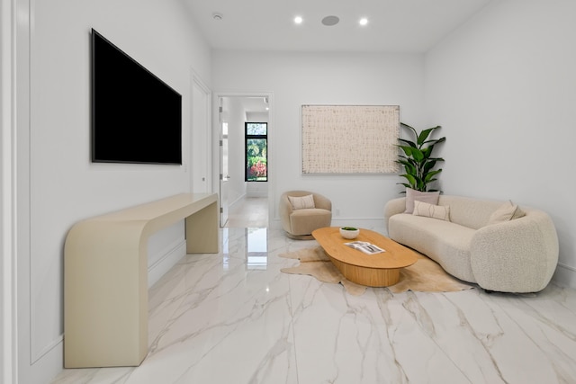 living room with recessed lighting and marble finish floor