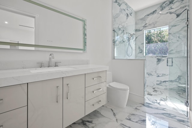 bathroom featuring a marble finish shower, marble finish floor, vanity, and toilet