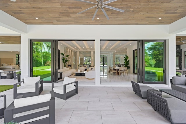 view of patio featuring ceiling fan and outdoor lounge area