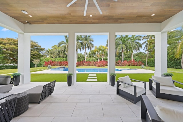 view of patio featuring a ceiling fan, an outdoor living space, and a fenced in pool