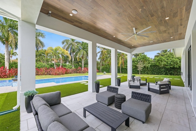 view of patio / terrace with ceiling fan, outdoor lounge area, and a fenced in pool