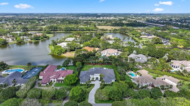 bird's eye view featuring a residential view and a water view