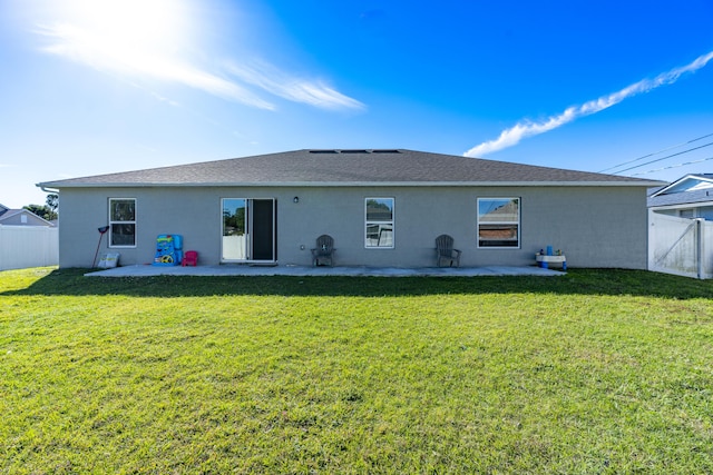 back of property featuring a patio area, a lawn, a fenced backyard, and stucco siding