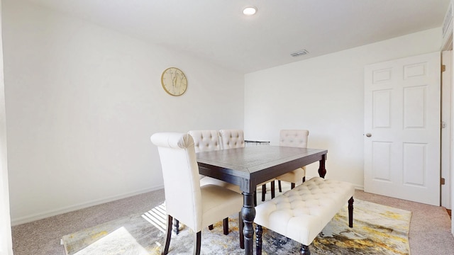 carpeted dining area featuring baseboards and recessed lighting