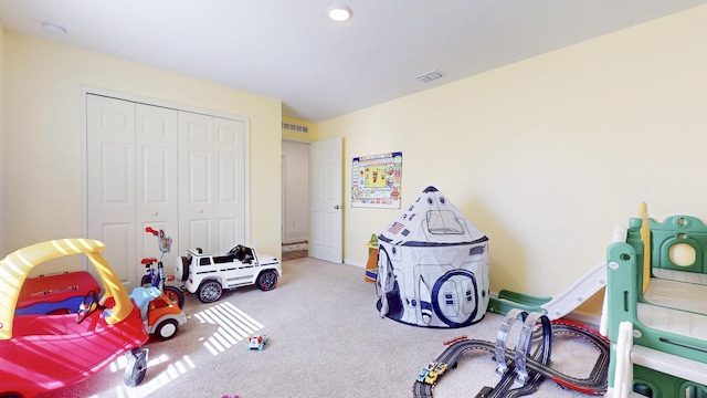 playroom featuring carpet floors and visible vents