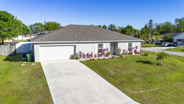 ranch-style home featuring concrete driveway, stucco siding, roof with shingles, fence, and a front yard