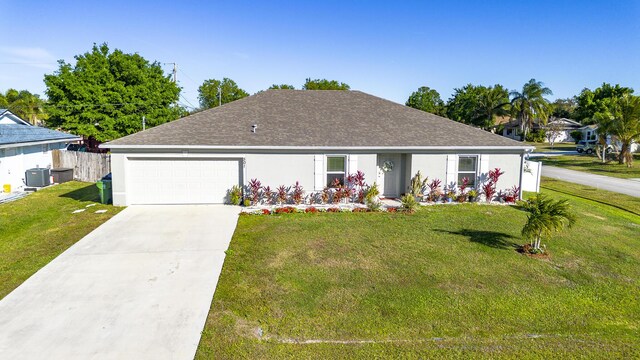 single story home featuring central AC unit, concrete driveway, an attached garage, a front yard, and stucco siding