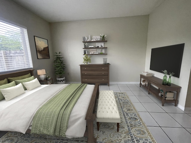 bedroom with tile patterned flooring and baseboards