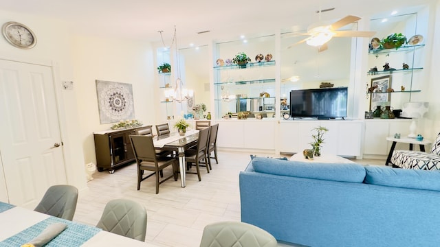 living room featuring a ceiling fan