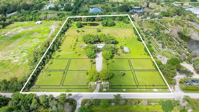 bird's eye view featuring a water view and a rural view