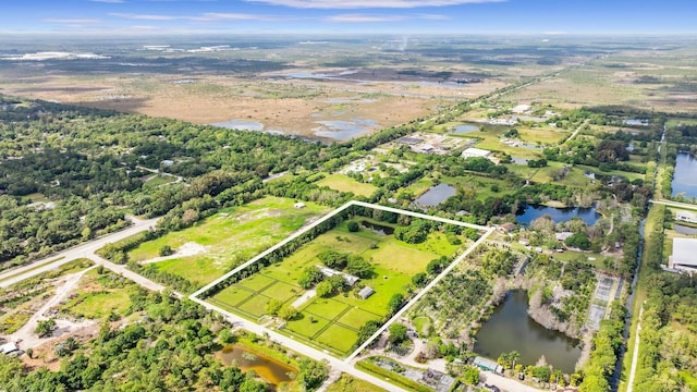 aerial view with a water view and a rural view