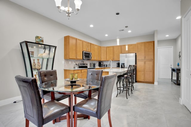 dining room with an inviting chandelier, visible vents, baseboards, and recessed lighting