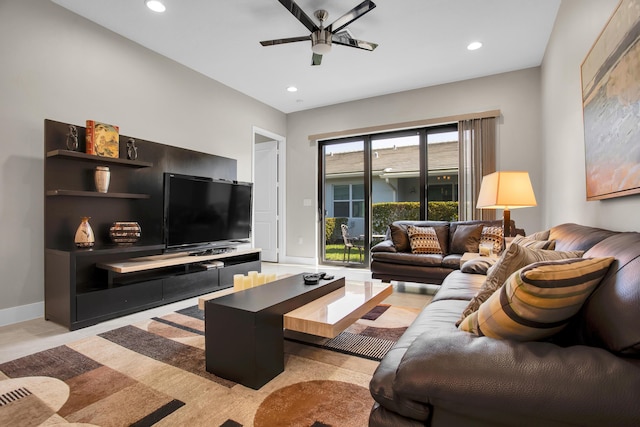 living area featuring baseboards, a ceiling fan, and recessed lighting