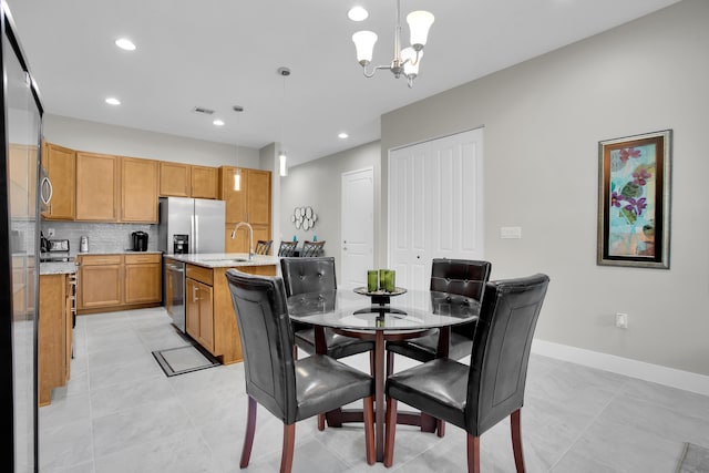 dining room with a notable chandelier, light tile patterned floors, recessed lighting, visible vents, and baseboards