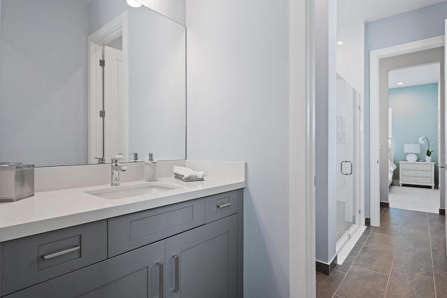 bathroom featuring vanity, a stall shower, and tile patterned flooring