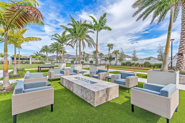 view of patio / terrace with an outdoor living space with a fire pit