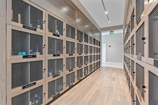 wine room featuring baseboards and wood finished floors