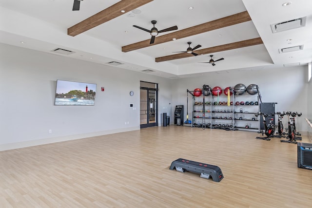 gym featuring visible vents, baseboards, and wood finished floors