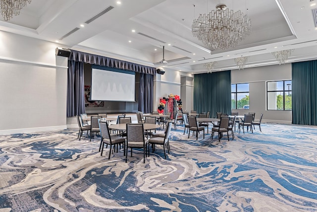 carpeted dining room featuring a chandelier, visible vents, baseboards, and a tray ceiling