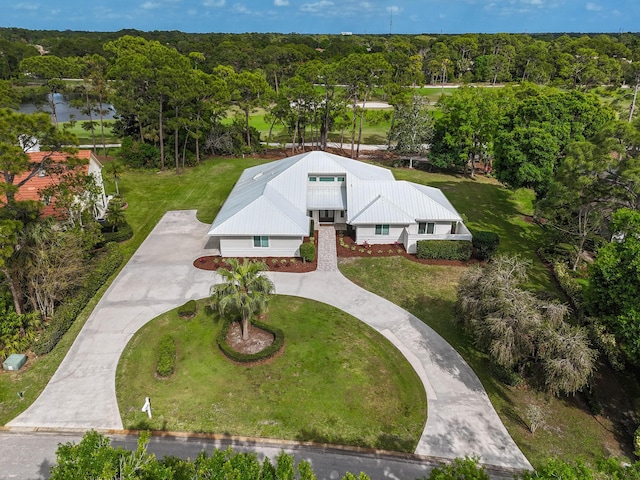 drone / aerial view featuring a view of trees