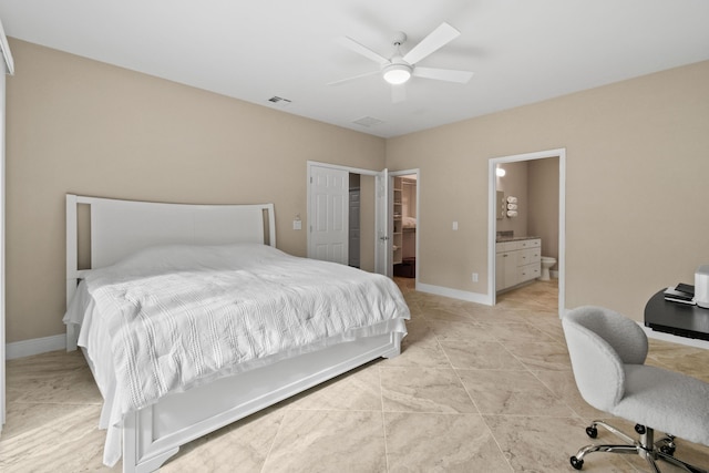 bedroom with ensuite bathroom, ceiling fan, visible vents, baseboards, and a closet