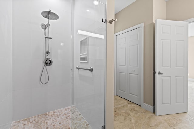 bathroom with a tile shower