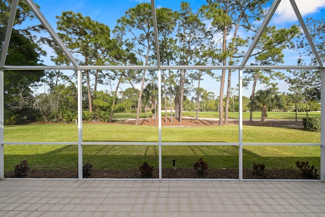 7250 Reserve Creek Dr, Port Saint Lucie, FL 34986 - unfurnished sunroom featuring view of scattered trees