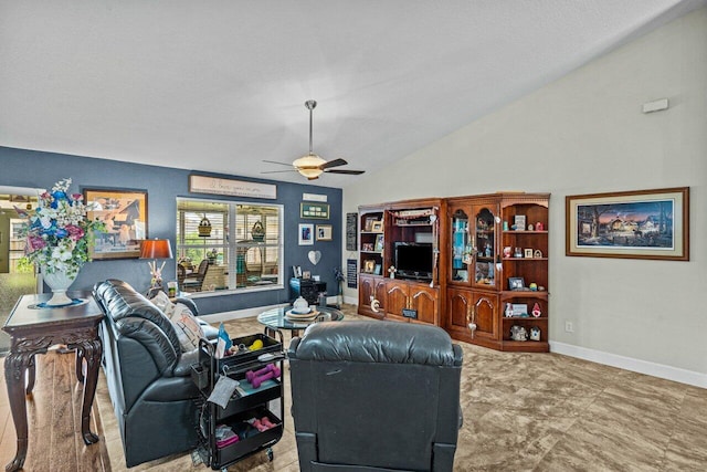 living area featuring vaulted ceiling, ceiling fan, and baseboards