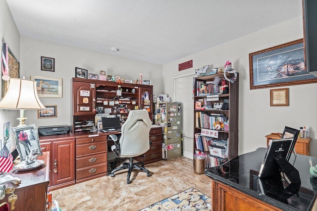 home office with a textured ceiling