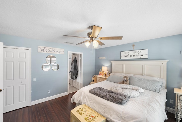 bedroom with baseboards, visible vents, a ceiling fan, dark wood-style flooring, and a textured ceiling