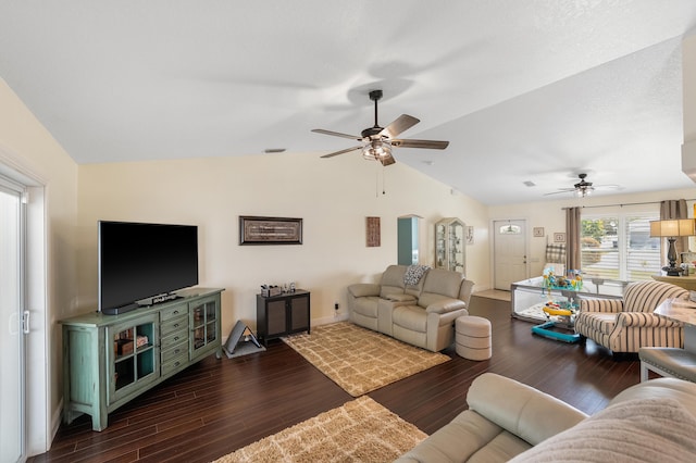 living area with dark wood-style floors, ceiling fan, baseboards, and vaulted ceiling