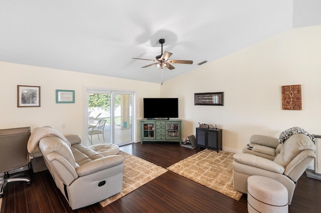 living room with dark wood-type flooring, vaulted ceiling, and a ceiling fan