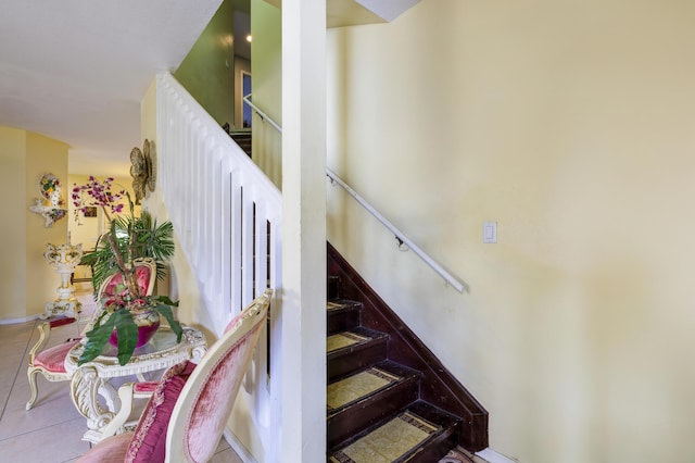 staircase featuring tile patterned floors