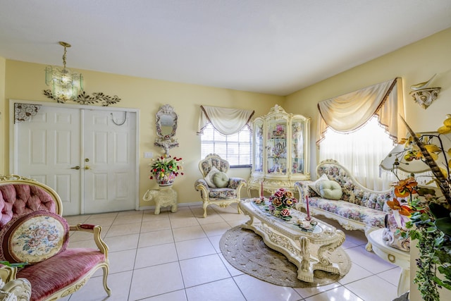 living area with baseboards and tile patterned floors