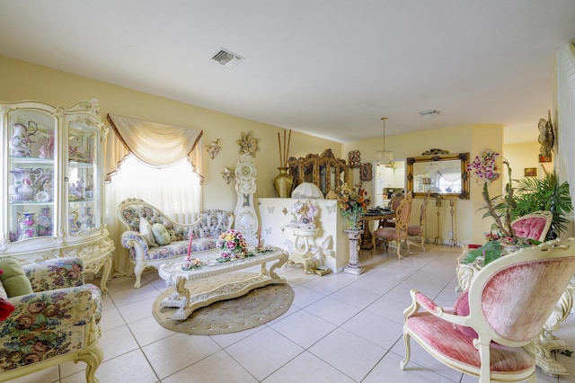 living area featuring tile patterned flooring and visible vents